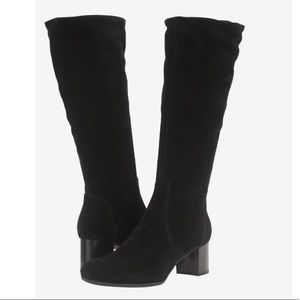 Italian calf leather heeled boots with waterproof construction rubber soles.